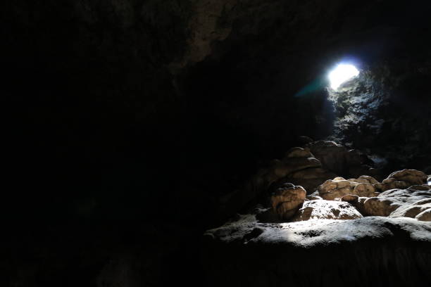 istock Cave from below with reflection of the sun 1287669311