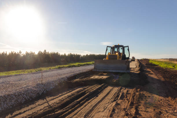 istock Bulldozer during road construction. Construction machinery. Earth moving by a bulldozer in the construction of a road. Excavator on a construction site of a road 1287669592