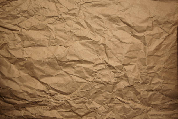 istock crumpled brown wrapping paper, natural texture, background 1287669863