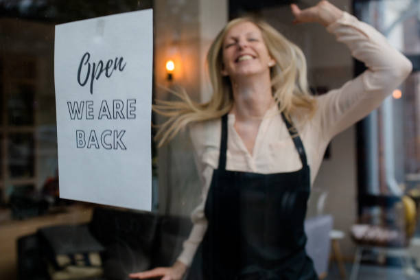 istock Innkeeper / cafe owner is happy that their business can open again 1287670530