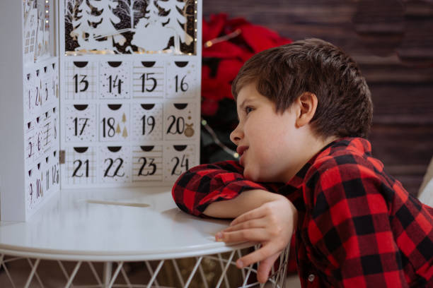 istock Boy counting day till Christmas 1287670540