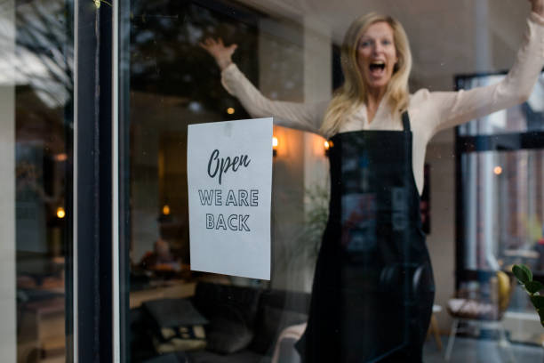 istock Innkeeper / cafe owner is happy that their business can open again 1287670554