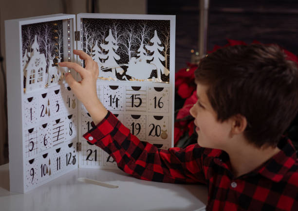 Boy counting day till Christmas