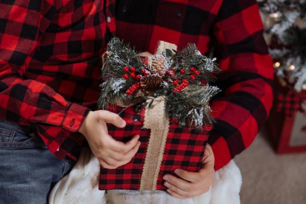 Father and son holding a gift box