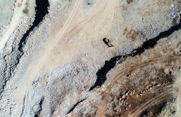 istock Heavy machines, including yellow trucks, in the working environment in a mine 1287671424