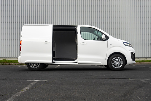 Berlin, Germany - 24th November, 2020: Electric delivery van Opel Vivaro-e stopped on a parking. This model is the first mass-produced electric light commercial vehicle from Opel.