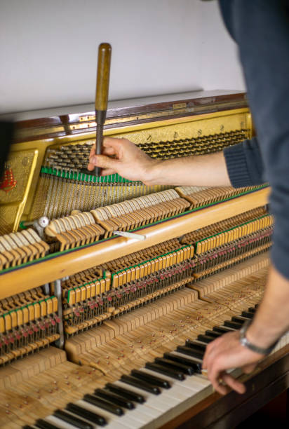 istock tune piano, piano tune, tuner, musical., vertical, 1287672826