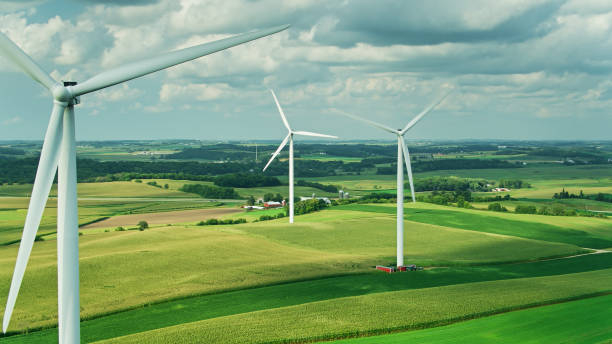 istock Wind Turbines Surrounded by Corn Growing in in Dane County, Wisconsin - Aerial 1287676510