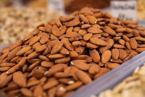 Display of a candy shop with with candied almonds in Naschmarkt, street food market in Vienna, Austria