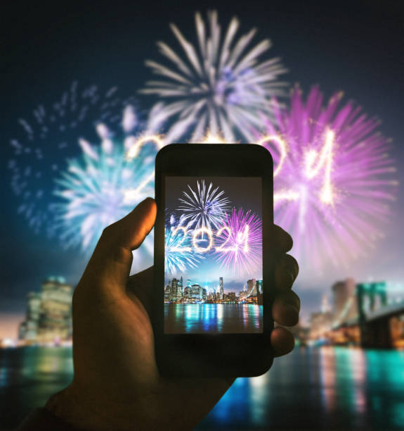 istock taking pics of the fireworks 1287676595