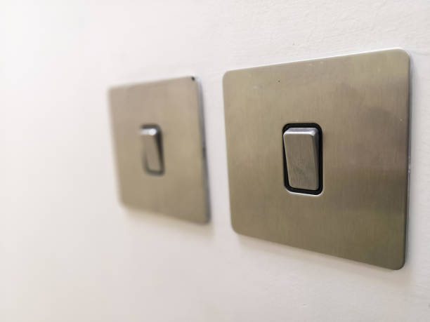 Electrical Switch In On Position Closeup Image Of Grey Color Electrical Switch In On Position light switch photos stock pictures, royalty-free photos & images