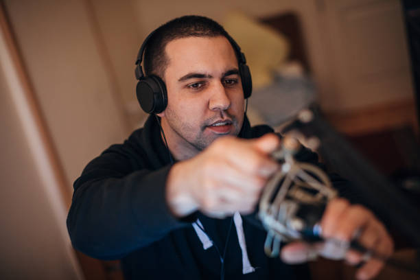 istock Male gamer preparing microphone for playing video games online 1287679024