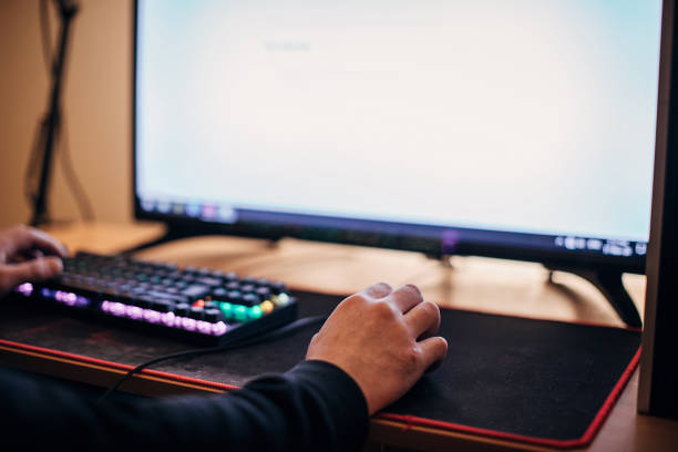 istock Male gamer playing video games on computer 1287679164