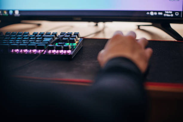 istock Male gamer playing video games on computer 1287679265