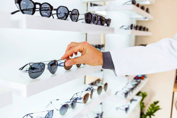 istock Man buying new sunglasses 1287679786