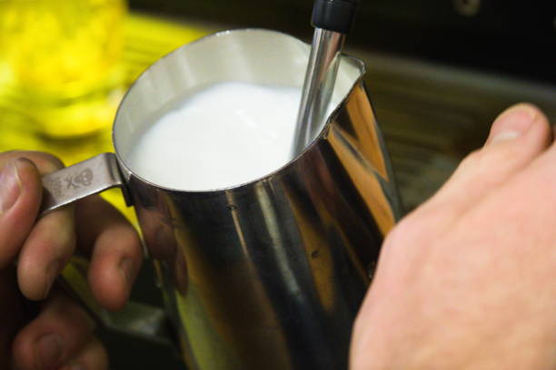 istock Barista Pours Steamed Milk 1287681469