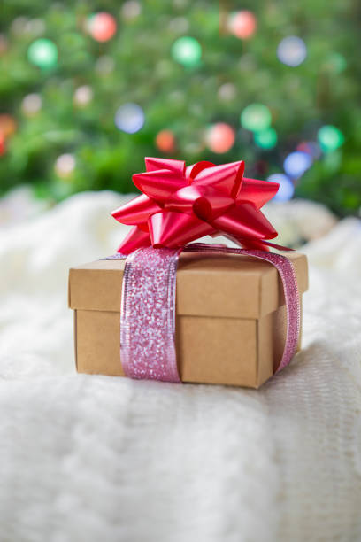istock beautiful festive surprise gift box with a red bow 1287682659