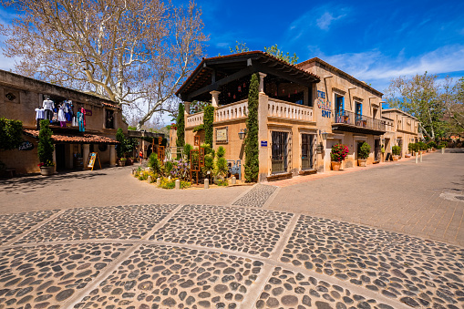 Sedona, Arizona USA - May 2, 2017: The Tlaquepaque Arts and Crafts Village, with vintage adobe style architecture, is a popular tourist destination filled with retail shops and restaurants.