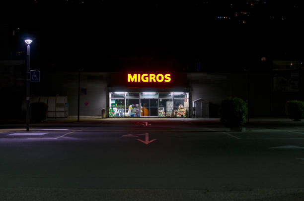 Migros supermarket entrance at night stock photo