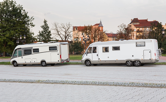 car campers traveling in a European city