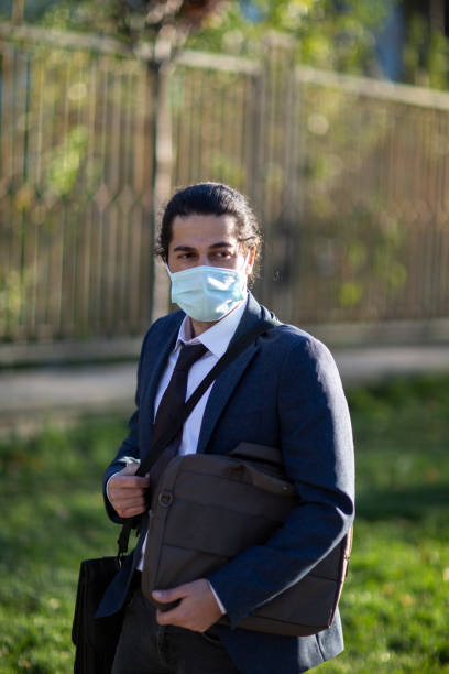 istock Businessman with protective mask during COVID-19 1287689218