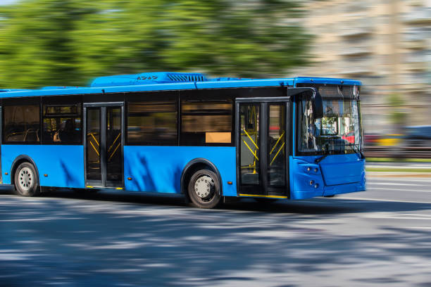 istock city bus goes along street 1287689245