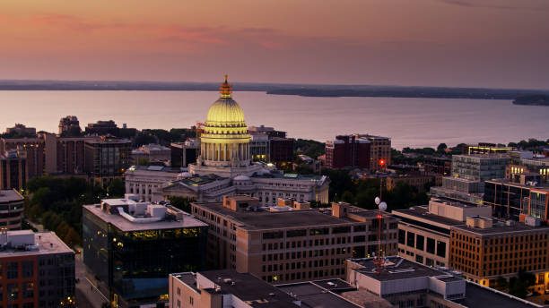 istock Aerial View Over Madison Rooftops at Sunset Towards Wisconsin State Capitol 1287690019