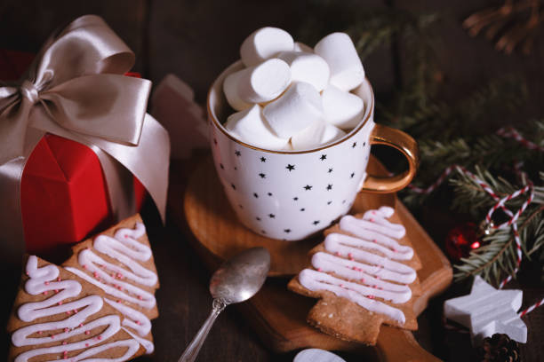 istock cup of coffee and marshmallows. Presents, gingerbread and Christmas decorations