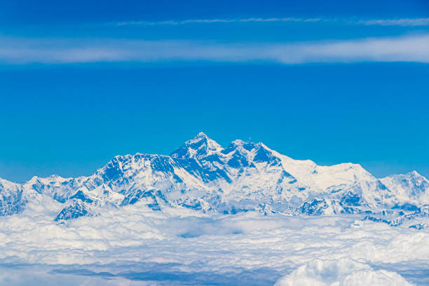 290 MPix XXXXL size panorama of Mount Ama Dablam - probably the most beautiful peak in Himalayas. \n This panoramic landscape is an very high resolution multi-frame composite and is suitable for large scale printing\nAma Dablam is a mountain in the Himalaya range of eastern Nepal. The main peak is 6,812  metres, the lower western peak is 5,563 metres. Ama Dablam means  'Mother's neclace'; the long ridges on each side like the arms of a mother (ama) protecting  her child, and the hanging glacier thought of as the dablam, the traditional double-pendant  containing pictures of the gods, worn by Sherpa women. For several days, Ama Dablam dominates  the eastern sky for anyone trekking to Mount Everest basecamp