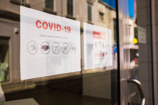 istock COVID-19 safety measures notice on store window 1287693016
