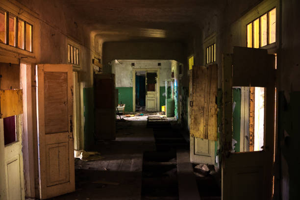 istock Dark creepy corridor of abandoned building 1287697028