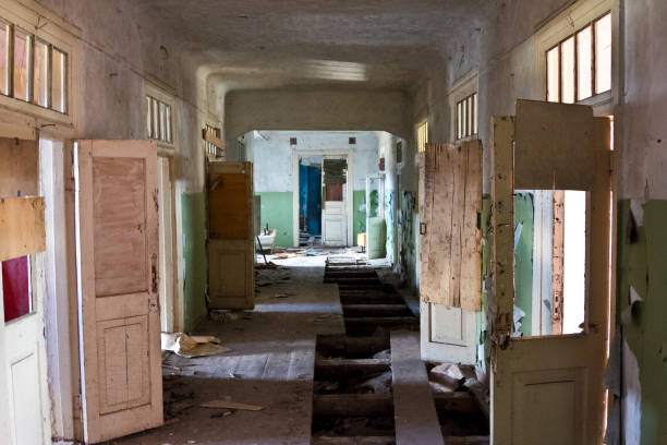 istock Dark creepy corridor of abandoned building 1287697038