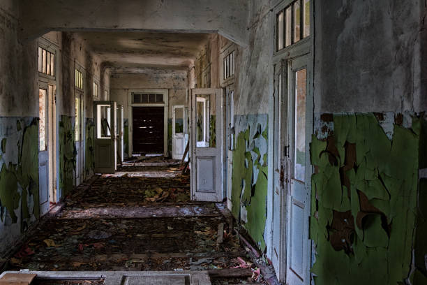 istock Dark creepy corridor of abandoned building 1287697058