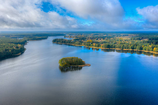 istock Aerial view of Omulew lake under blue cloudy sky 1287698045