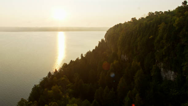 istock Drone Shot of Sun Setting Over Lake Michigan 1287698314