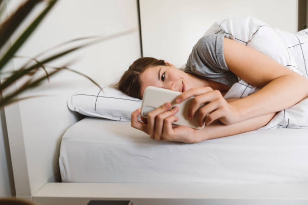 istock Checking the phone first thing in the morning 1287698948