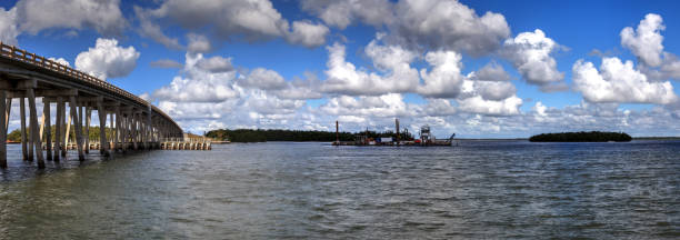 istock The dredging of New Pass under Big Hickory Bridge 1287701994