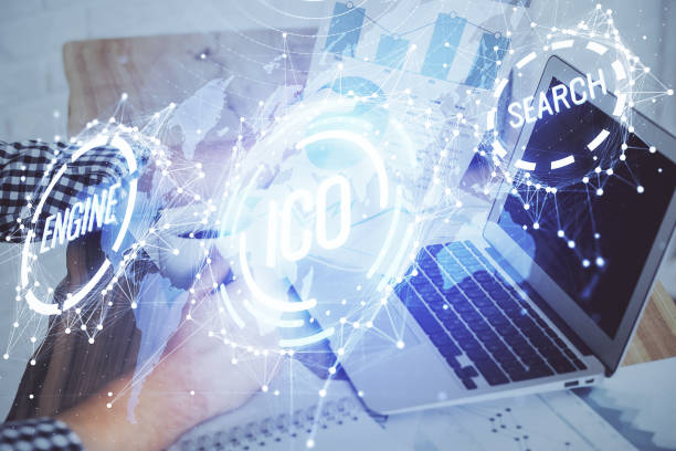 istock Crypto currency theme hologram with businessman working on computer on background. Concept of blockchain. Double exposure. 1287704789