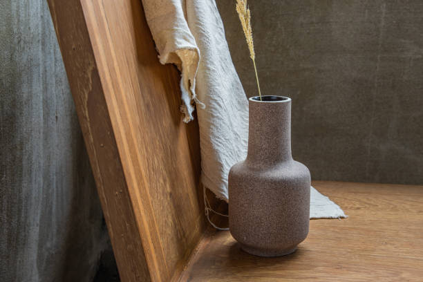 istock Handmade Ceramic Vase on wooden chair. 1287706426