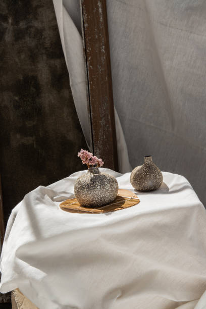 istock Dried flowers in Handmade Double Ceramic Vases on table. 1287706443