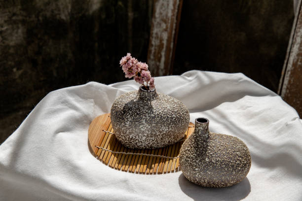 istock Dried flowers in Handmade Double Ceramic Vases on table. 1287706459
