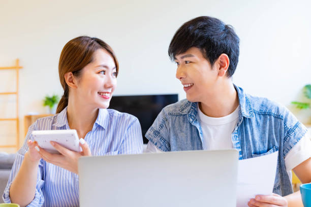 istock couple discuss finances at home 1287713263