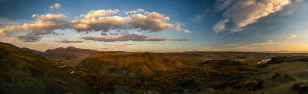 istock Mountains and hills altai in autumn, panoramic photo. 1287719658