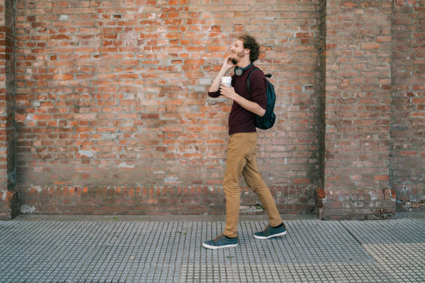 istock Young man talking on the phone outdoors. 1287722744