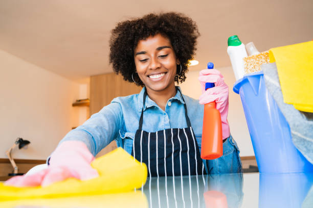 istock Afro woman cleaning new home. 1287722821