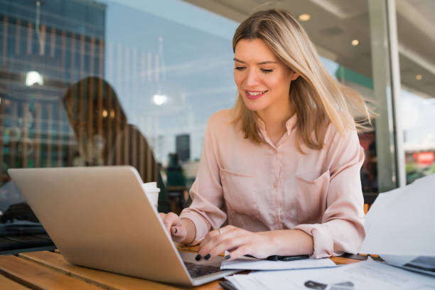 istock Young businesswoman working on her laptop. 1287723038