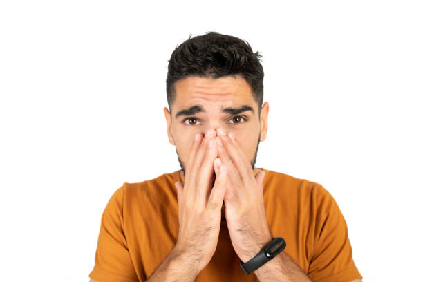 istock Portrait of young man looking scared. 1287723071