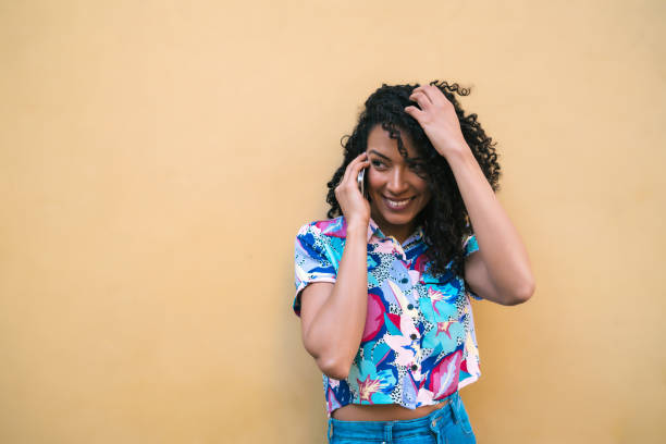 istock Afro woman talking on the phone. 1287724060