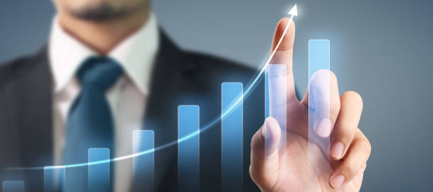 istock Businessman plan graph growth and increase of chart positive indicators in his business 1287726044