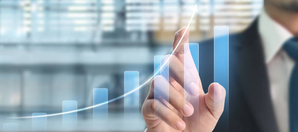 istock Businessman plan graph growth and increase of chart positive indicators in his business 1287726053